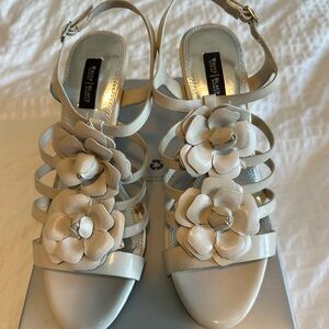 Cream heels with flower detail on top